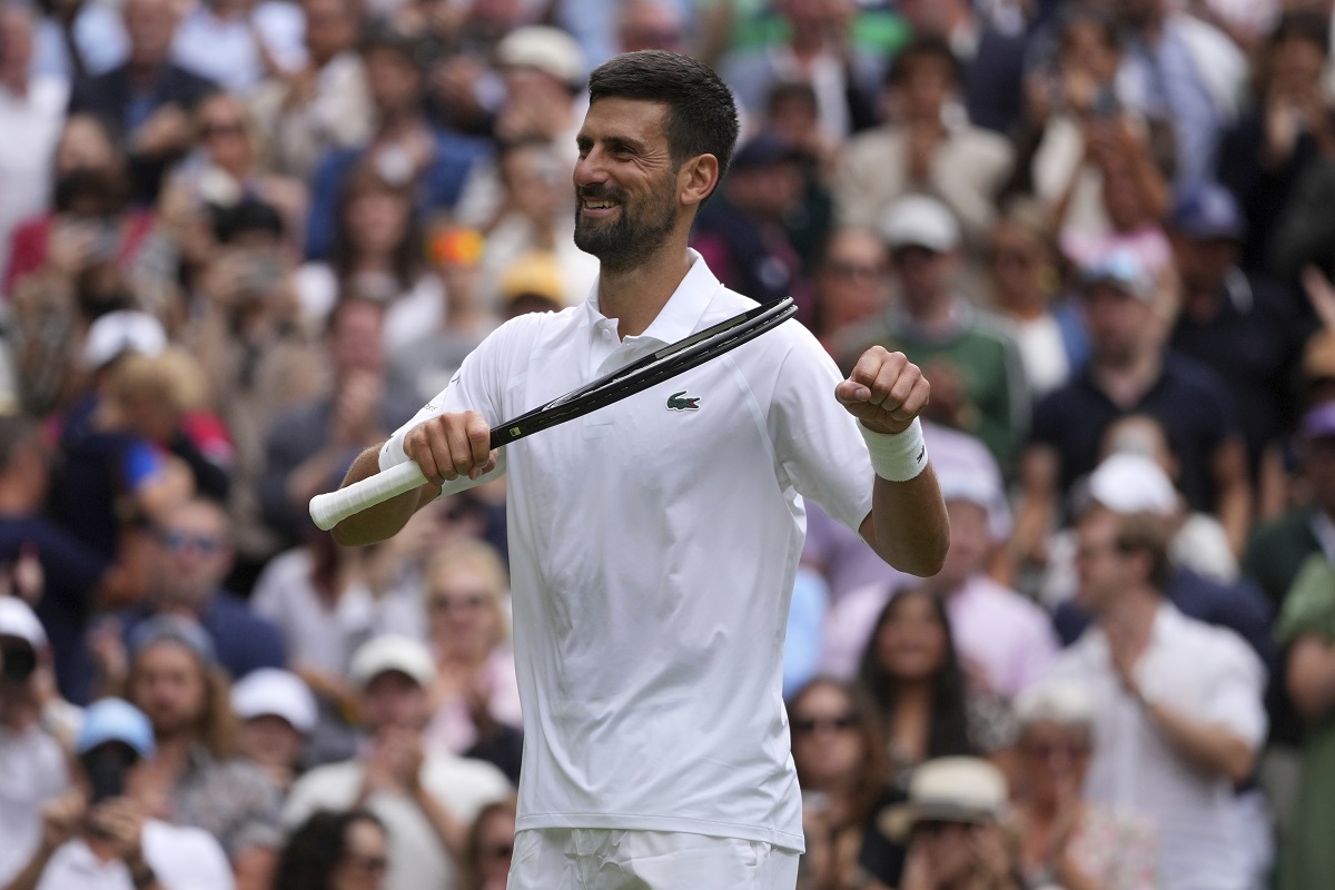 Serbia's Novak Djokovic celebrates after beating Australia's Alex de Minaur during a fourth round men's singles match at the Wimbledon Tennis Championships in London, Monday, July 7, 2025. (AP Photo/Kin Cheung)