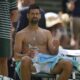 Novak Djokovic of Serbia sits in his chair during a change of ends break as he plays Daniel Evans of Britain during their second round men's singles match at the Wimbledon Tennis Championships in London, Thursday, July 3, 2025. (AP Photo/Alastair Grant)