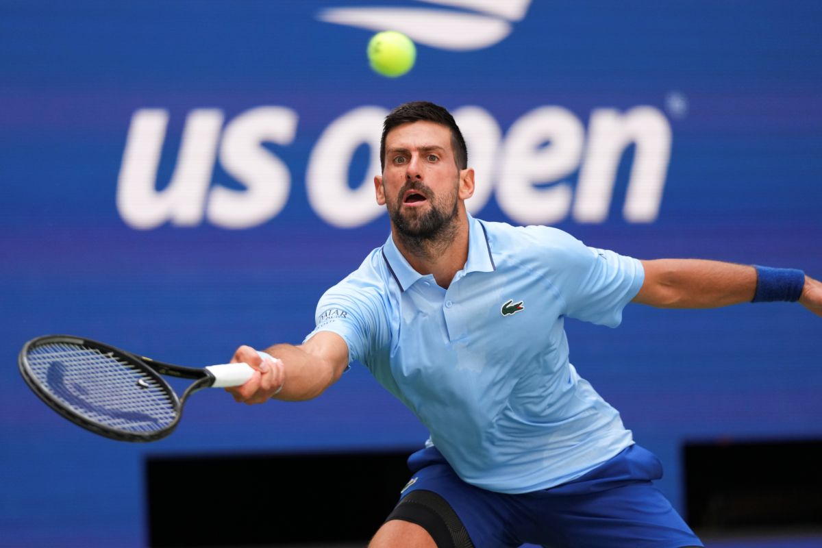 Novak Djokovic, of Serbia, returns a shot to Zachary Svajda, of the United States, during the second round of the U.S. Open tennis championships, Wednesday, Aug. 27, 2025, in New York. (AP Photo/Kirsty Wigglesworth)