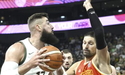 Jonas Valanciunas of Lithuania and Jonas Vucevic of Montenegro during the Eurobasket, European Basketball Championship group B match between Lithuania and Montenegro in Tampere, Finland, Friday, Aug. 29, 2025. (Heikki Saukkomaa/Lehtikuva via AP)
