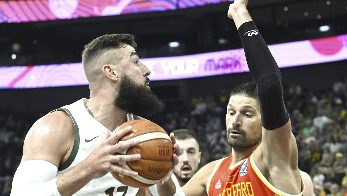 Jonas Valanciunas of Lithuania and Jonas Vucevic of Montenegro during the Eurobasket, European Basketball Championship group B match between Lithuania and Montenegro in Tampere, Finland, Friday, Aug. 29, 2025. (Heikki Saukkomaa/Lehtikuva via AP)