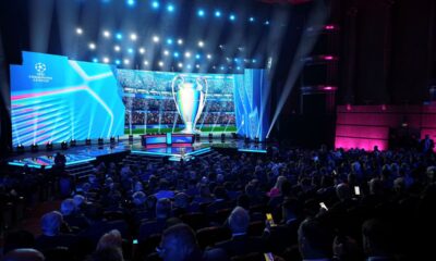 The stage is illuminated before the start of the Champions League soccer league phase draw in Monaco, Thursday, Aug. 28, 2025. (AP Photo/Laurent Cipriani)