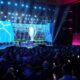 The stage is illuminated before the start of the Champions League soccer league phase draw in Monaco, Thursday, Aug. 28, 2025. (AP Photo/Laurent Cipriani)