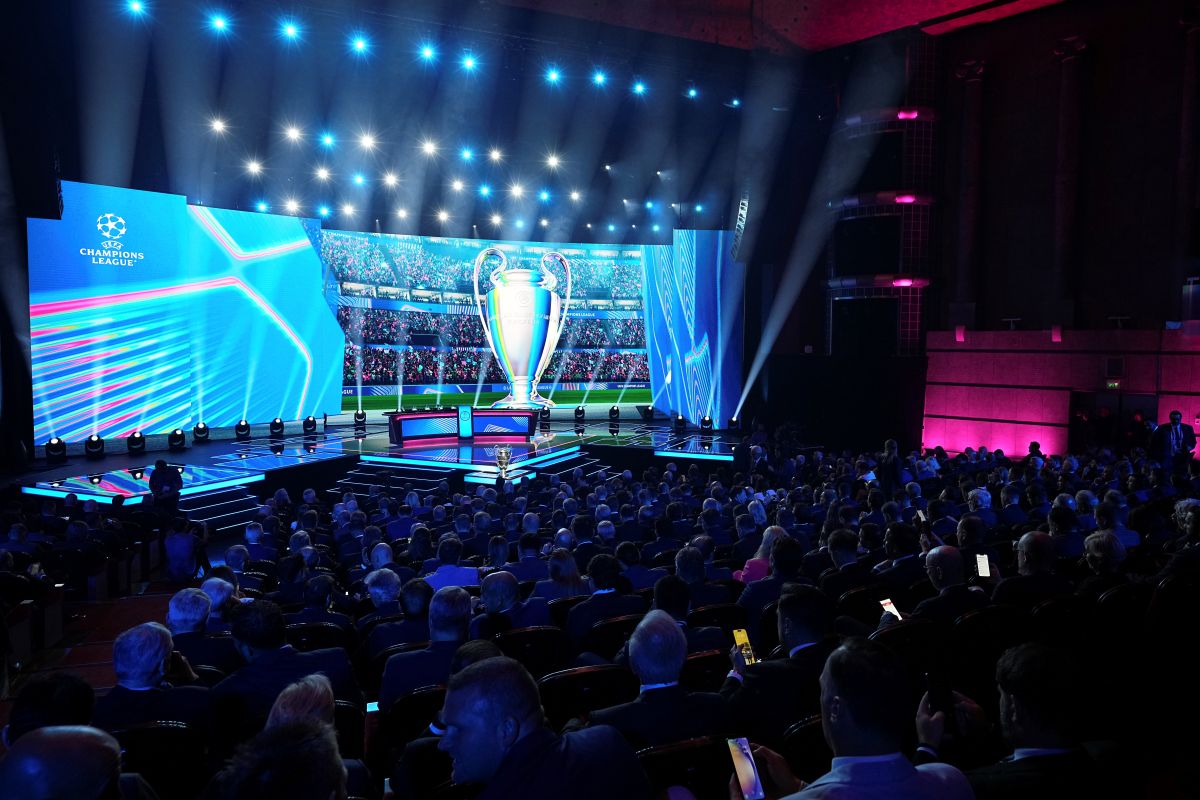 The stage is illuminated before the start of the Champions League soccer league phase draw in Monaco, Thursday, Aug. 28, 2025. (AP Photo/Laurent Cipriani)
