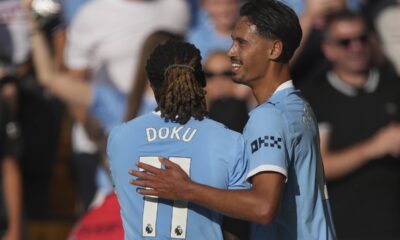 Manchester City's Tijjani Reijnders, right, celebrates with Manchester City's Jeremy Doku after scoring his sides second goal during the English Premier League soccer match between Wolverhampton Wanderers and Manchester City at Molineux Stadium, Wolverhampton, England, Saturday, Aug. 16, 2025. (AP Photo/Dave Shopland)