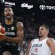 Germany's Johannes Thiemann, left, drives to the basket past Serbia's Nikola Jokic during the final of the Supercup basketball tournament, Saturday, Aug. 16, 2025, in Munich, Germany. (Sven Hoppe/dpa via AP)