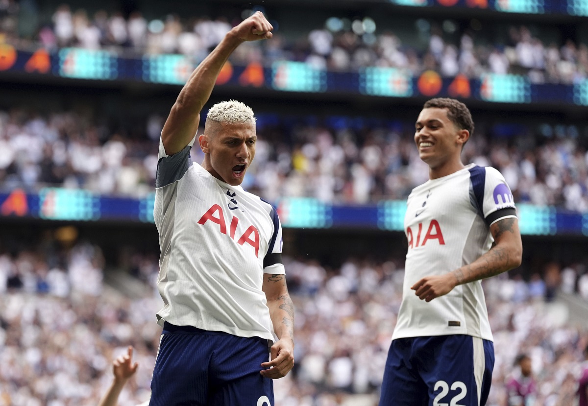 Tottenham Hotspur's Richarlison, left, celebrates scoring the opening goal during the the English Premier League soccer match between Tottenham Hotspur and Burnley at the Tottenham Hotspur Stadium in London, Saturday, Aug. 16, 2025. (Adam Davy/PA via AP)