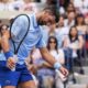 Novak Djokovic, of Serbia, reacts during a mixed doubles match at the U.S. Open tennis championships, Tuesday, Aug. 19, 2025, in New York. (AP Photo/Yuki Iwamura)