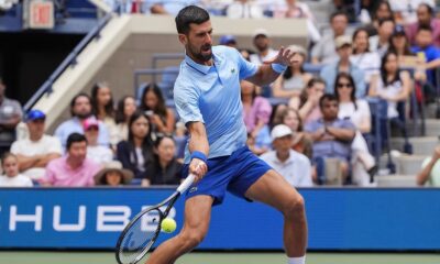 Novak Djokovic, of Serbia, returns a shot during a mixed doubles match at the U.S. Open tennis championships, Tuesday, Aug. 19, 2025, in New York. (AP Photo/Yuki Iwamura)