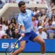 Novak Djokovic, of Serbia, returns a shot during a mixed doubles match at the U.S. Open tennis championships, Tuesday, Aug. 19, 2025, in New York. (AP Photo/Yuki Iwamura)