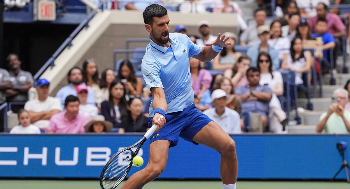 Novak Djokovic, of Serbia, returns a shot during a mixed doubles match at the U.S. Open tennis championships, Tuesday, Aug. 19, 2025, in New York. (AP Photo/Yuki Iwamura)
