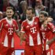 Bayern Munich's Harry Kane, center, celebrates scoring during the Bundesliga soccer match between Bayern Munich and RB Leipzig at Allianz Arena, Munich, Germany, Friday Aug. 22, 2025. (Sven Hoppe/dpa via AP)