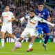 Leeds United's Jayden Bogle, center, and Everton's Carlos Alcaraz, right, battle for the ball during the English Premier League soccer match between Leeds United and Everton at Elland Road, in Leeds, England, Monday, Aug. 18, 2025. (Danny Lawson/PA via AP)