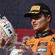 McLaren driver Lando Norris of Britain celebrates on the podium after winning the Hungarian Formula One Grand Prix race at the Hungaroring racetrack in Mogyorod, Hungary, Sunday, Aug. 3, 2025. (AP Photo/Denes Erdos)