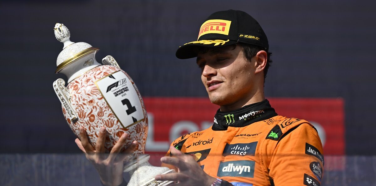 McLaren driver Lando Norris of Britain celebrates on the podium after winning the Hungarian Formula One Grand Prix race at the Hungaroring racetrack in Mogyorod, Hungary, Sunday, Aug. 3, 2025. (AP Photo/Denes Erdos)