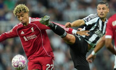 Liverpool's Hugo Ekitike, left, and Newcastle's Fabian Schaer fight for the ball during the Premier League soccer match between Newcastle and Liverpool in Newcastle, England, Monday, Aug. 25, 2025. (AP Photo/Jon Super)