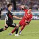 Liverpool's Darwin Nunez, right, and Marinos' Ren Kato battle for control of the ball during a friendly soccer match between Yokohama F. Marinos and Liverpool F.C. at Nissan Stadium in Yokohama, Japan, Wednesday, July 30, 2025. (AP Photo/Eugene Hoshiko)
