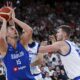 Serbia's Nikola Jokic, left, and Czech Republic's Martin Peterka in action during the Basketball Supercup semifinal between Serbia and Czech Republic, in the SAP Garden, Munich, Germany, Friday Aug. 15, 2025. (Sven Hoppe/dpa via AP)