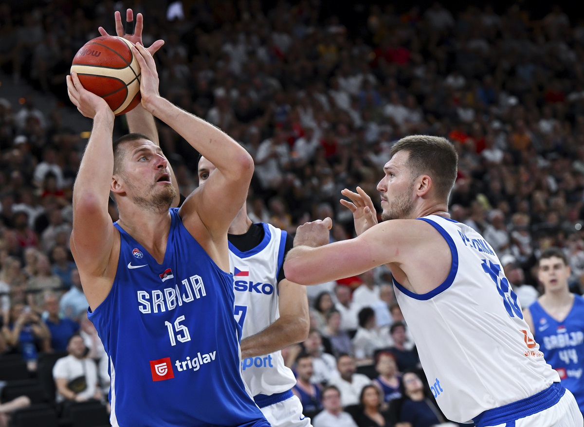 Serbia's Nikola Jokic, left, and Czech Republic's Martin Peterka in action during the Basketball Supercup semifinal between Serbia and Czech Republic, in the SAP Garden, Munich, Germany, Friday Aug. 15, 2025. (Sven Hoppe/dpa via AP)
