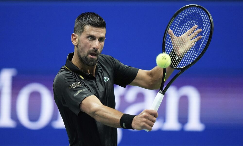Novak Djokovic, of Serbia, returns a shot to Learner Tien, of the United States, during the first-round of the U.S. Open tennis championships, Sunday, Aug. 24, 2025, in New York. (AP Photo/Frank Franklin II)
