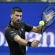 Novak Djokovic, of Serbia, returns a shot to Learner Tien, of the United States, during the first-round of the U.S. Open tennis championships, Sunday, Aug. 24, 2025, in New York. (AP Photo/Frank Franklin II)