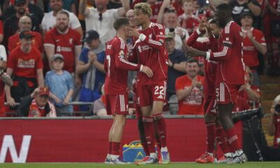Liverpool's Hugo Ekitike, centre, celebrates after scoring his side's opening goal during the English Premier League soccer match between Liverpool and Bournemouth at Anfield stadium in Liverpool, England, Friday, Aug. 15, 2025. (AP Photo/Ian Hodgson)