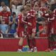 Liverpool's Hugo Ekitike, centre, celebrates after scoring his side's opening goal during the English Premier League soccer match between Liverpool and Bournemouth at Anfield stadium in Liverpool, England, Friday, Aug. 15, 2025. (AP Photo/Ian Hodgson)