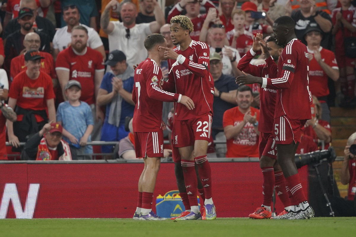 Liverpool's Hugo Ekitike, centre, celebrates after scoring his side's opening goal during the English Premier League soccer match between Liverpool and Bournemouth at Anfield stadium in Liverpool, England, Friday, Aug. 15, 2025. (AP Photo/Ian Hodgson)