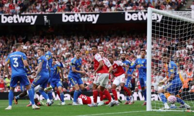 Arsenal's Jurrien Timber, at left on the ground, scores the opening goal during the English Premier League soccer match between Arsenal and Leeds United at Emirates stadium in London, England, Saturday, Aug. 23, 2025. (AP Photo/Ian Walton)