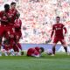 Liverpool's Harvey Elliott on the floor behind the wall during a free kick during the pre-season friendly soccer match between Liverpool and Athletic Bilbao, at Anfield, Liverpool, England, Monday Aug. 4, 2025. (Peter Byrne/PA via AP)