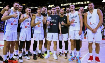 Serbia players pose with the trophy after defeating Germany in the final of the Supercup basketball tournament, Saturday, Aug. 16, 2025, in Munich, Germany. (Sven Hoppe/dpa via AP)