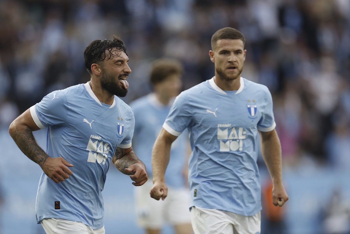 Malmö's Sead Hakšabanović, left, celebrates after scoring a goal during the Champions League qualifying round soccer match between Sweden's Malmö FF and Latvia's RFS, Wednesday, July 30, 2025, in Malmö, Sweden,. (Andreas Hillergren/TT News Agency via AP)
