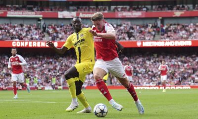 Arsenal's Viktor Gyokeres, right, and Villarreal's Pape Gueye battle for the ball during the Emirates Cup match at the Emirates Stadium, London, Wednesday Aug. 6, 2025. (John Walton/PA via AP)